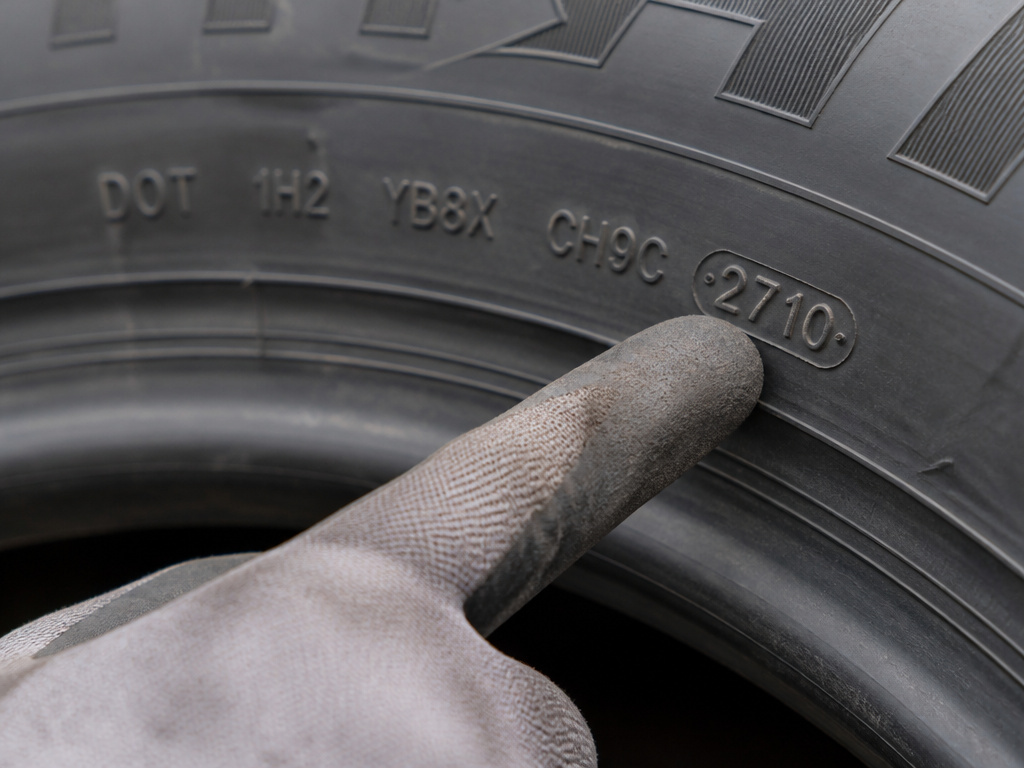 Close-up of a truck tire DOT date code, showing week and year of manufacture.
